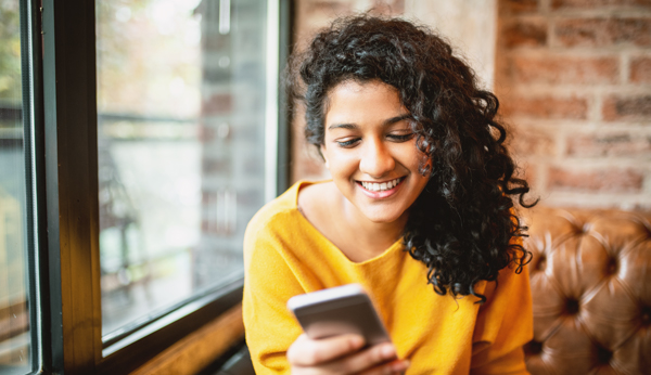 woman looking at mobile device