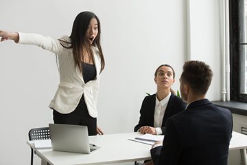 upset interviewer pointing to get out